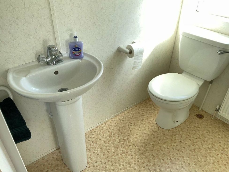 A bathroom with a sink and toilet at St Monans Holiday Park - Holiday Accommodation 19927 Anstruther