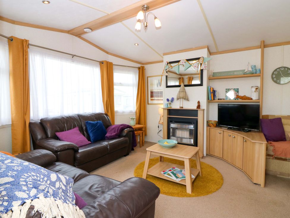A living room with a sofa and coffee table at St Monans Holiday Park - Holiday Accommodation 19927 in St Monans