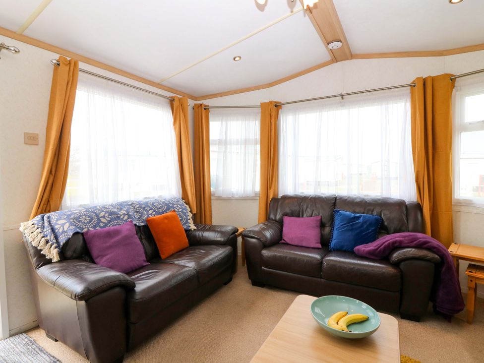A living room with two sofas and a coffee table at St Monans Holiday Park - Holiday Accommodation 19927, St Monans