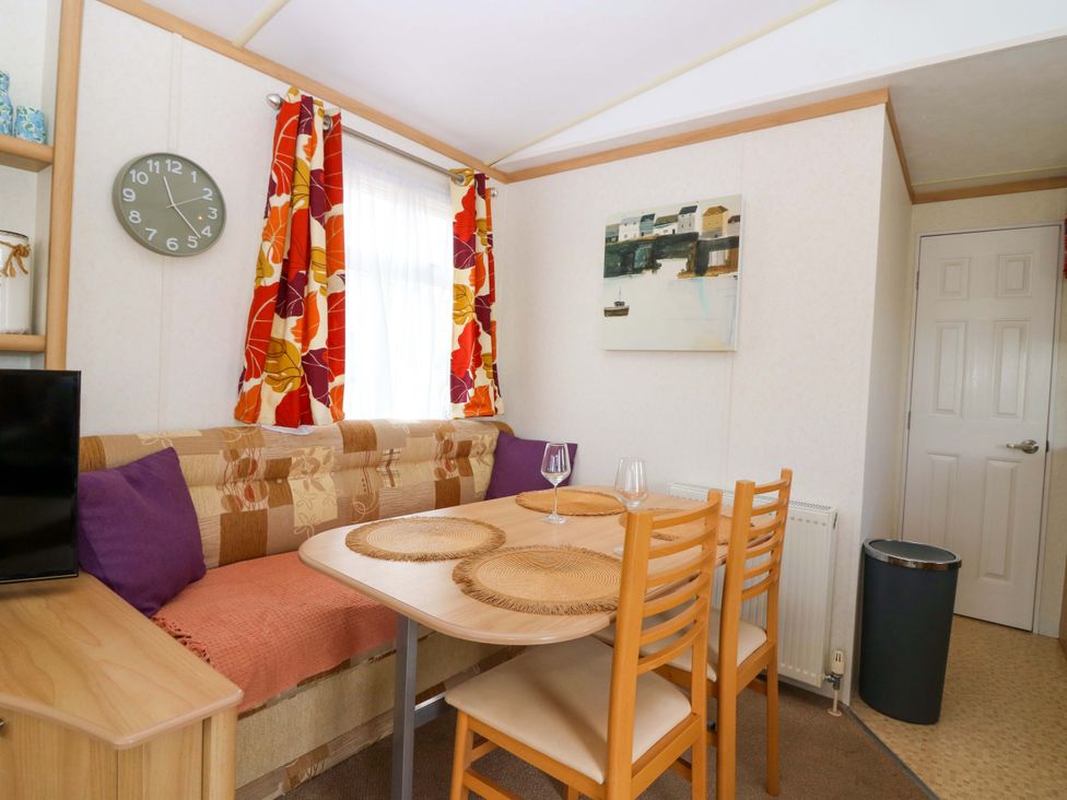 A dining room with a table and chairs at St Monans Holiday Park - Holiday Accommodation 19927, St Monans
