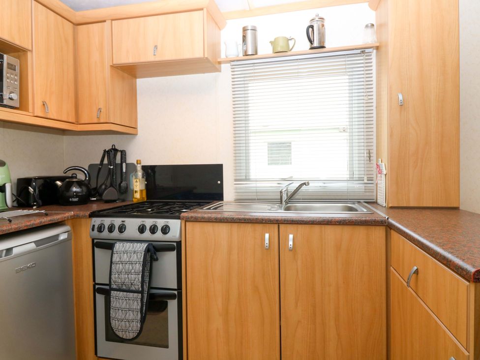 A kitchen with appliances and utensils at St Monans Holiday Park - Holiday Accommodation 19927 St Monans