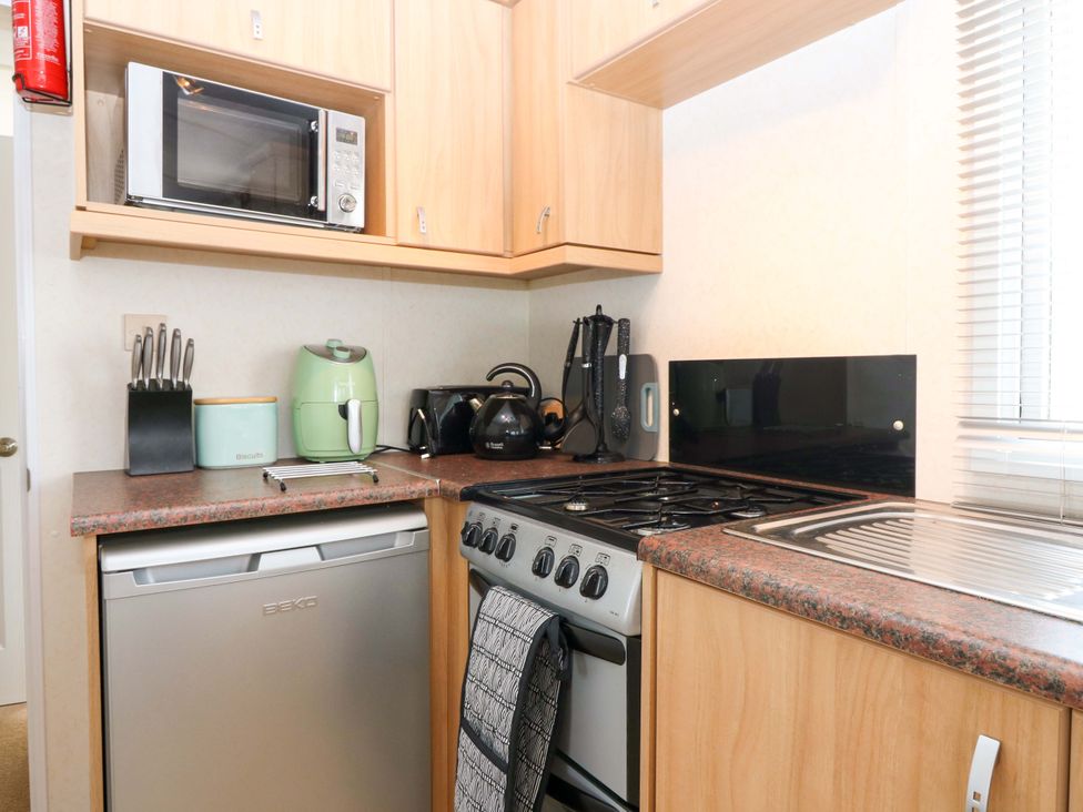 A kitchen with various appliances at St Monans Holiday Park - Holiday Accommodation 19927, St Monans
