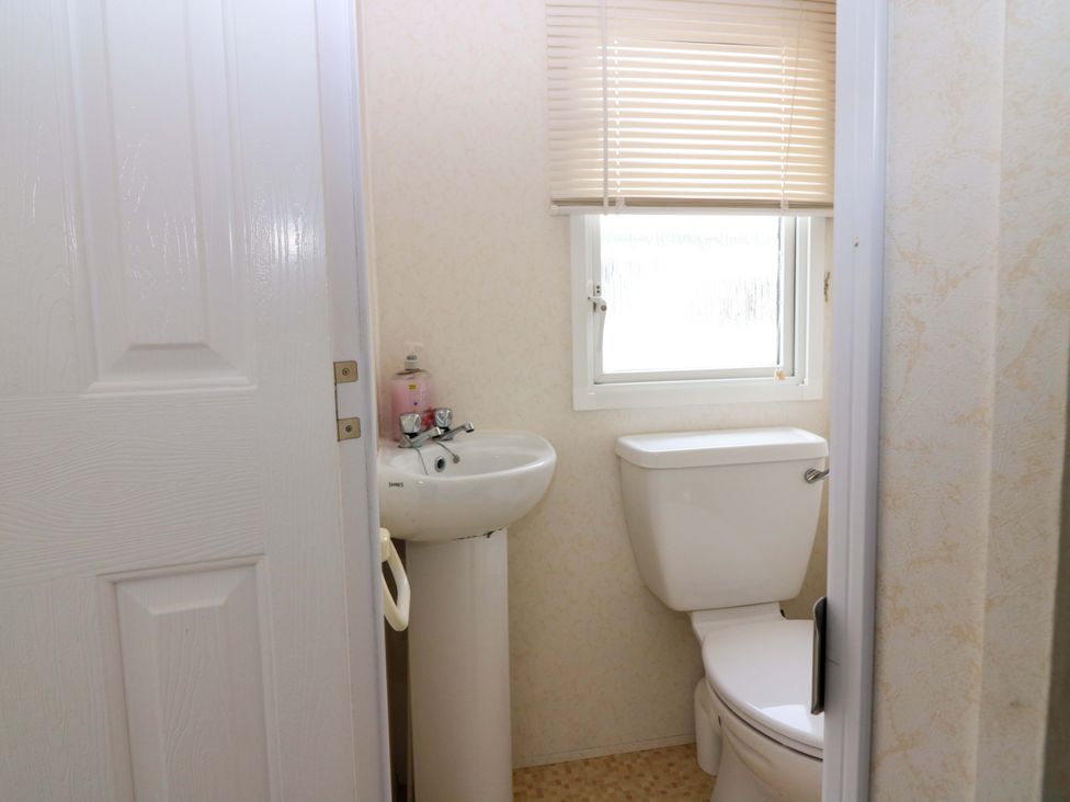 A bathroom with a sink and toilet at St Monans Holiday Park - Holiday Accommodation 19927, St Monans