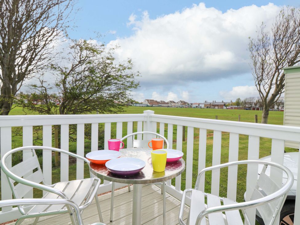 A balcony with table and chairs at St Monans Holiday Park - Holiday Accommodation 19927 in St Monans