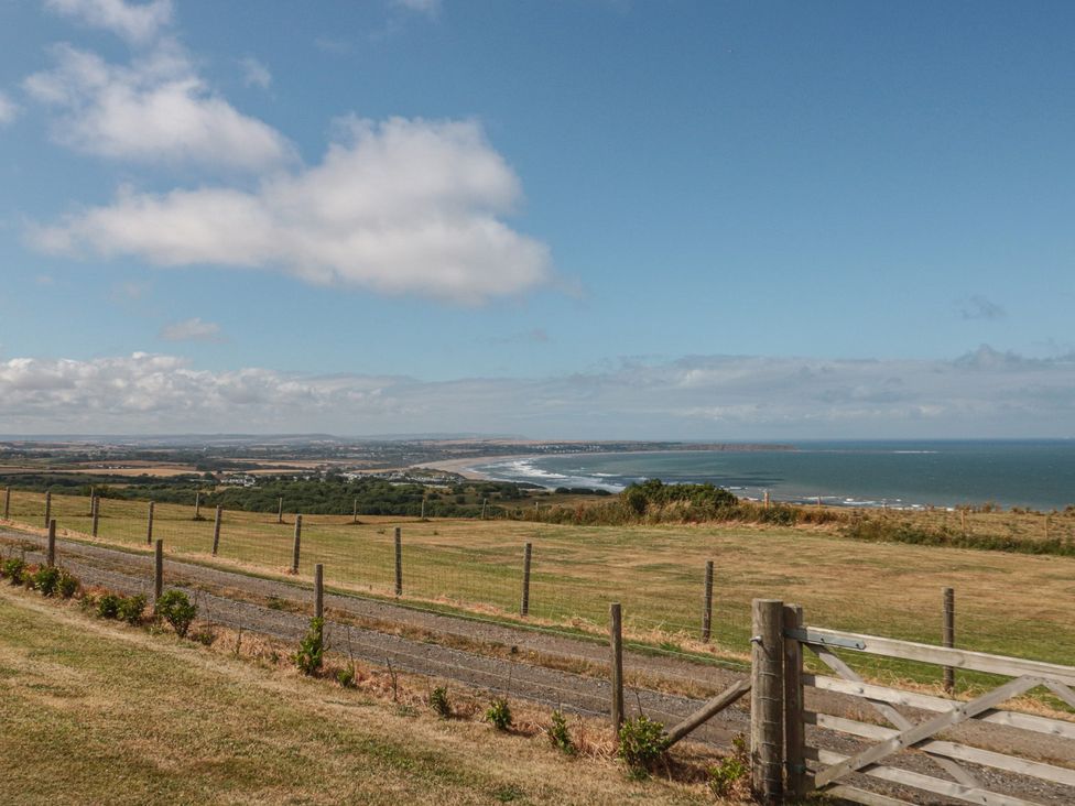 A landscape view of ocean and fields at Bay View
