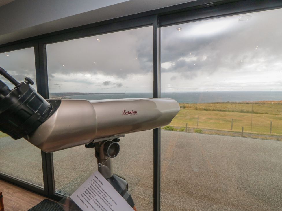 A telescope overlooking the ocean with a view at Bay View