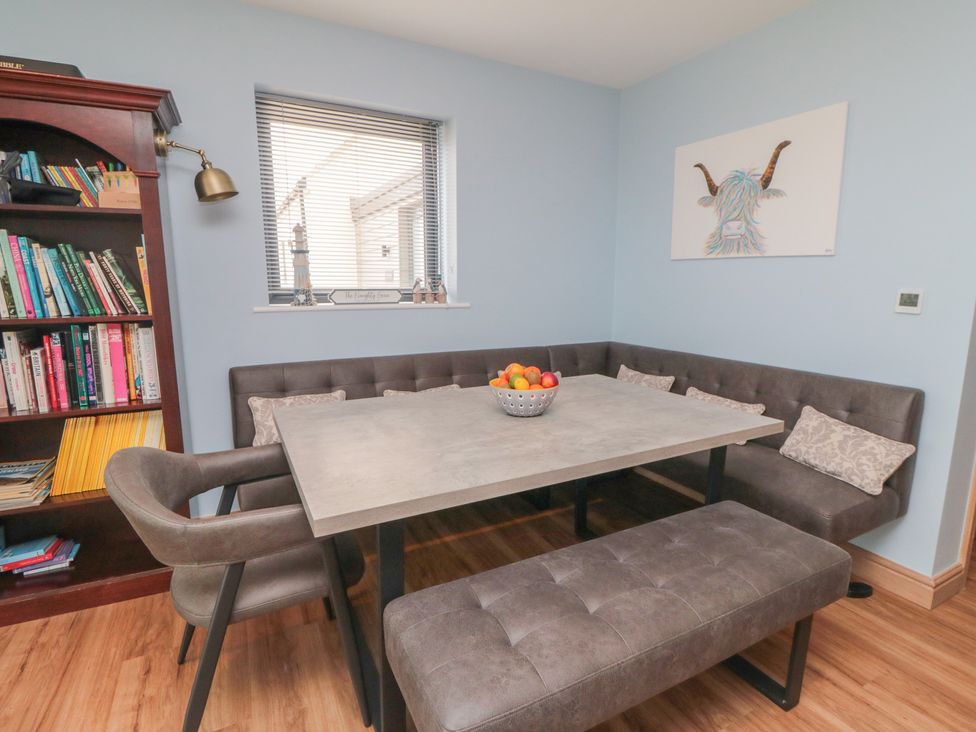 A dining area with a table and seating at Bay View