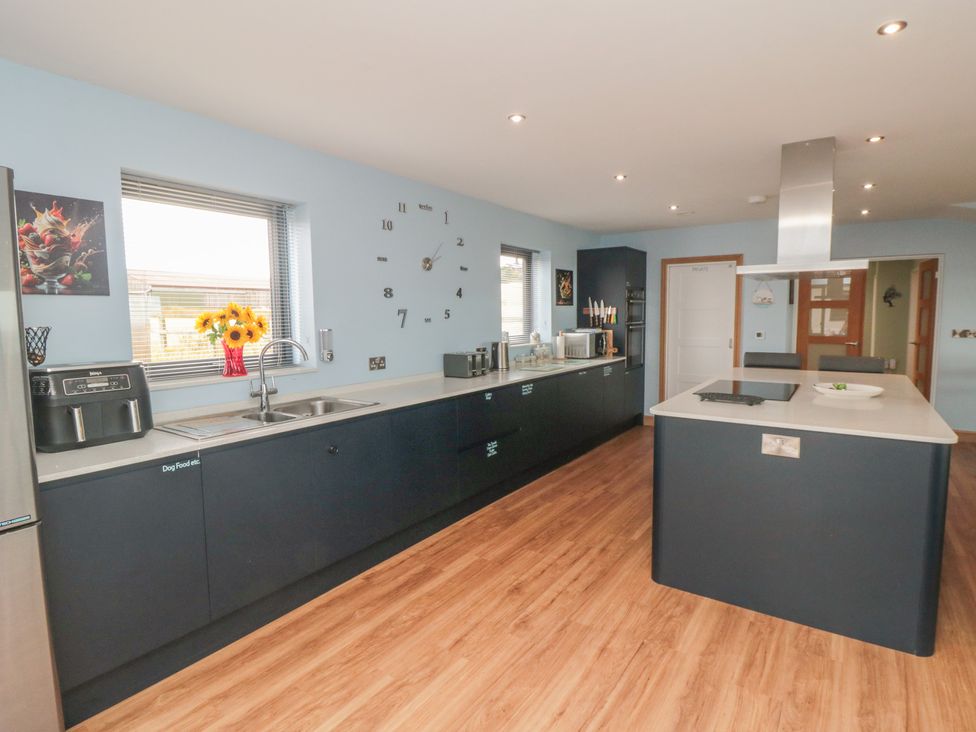 A kitchen with cabinets and a stove at Bay View