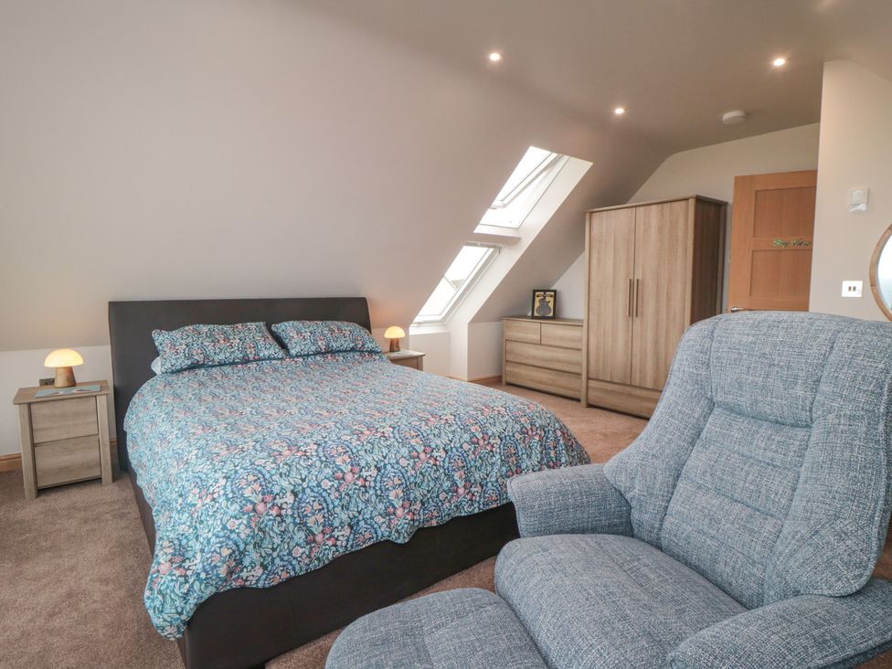 A bedroom with a bed and skylight at Bay View