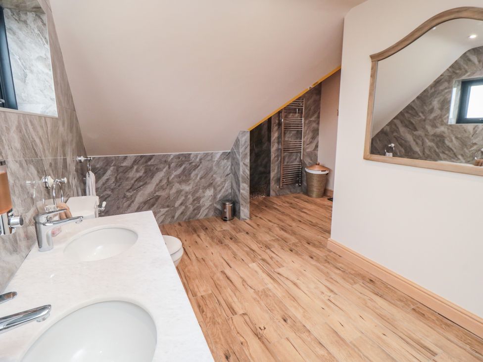 A bathroom with sinks and a towel rack at Bay View