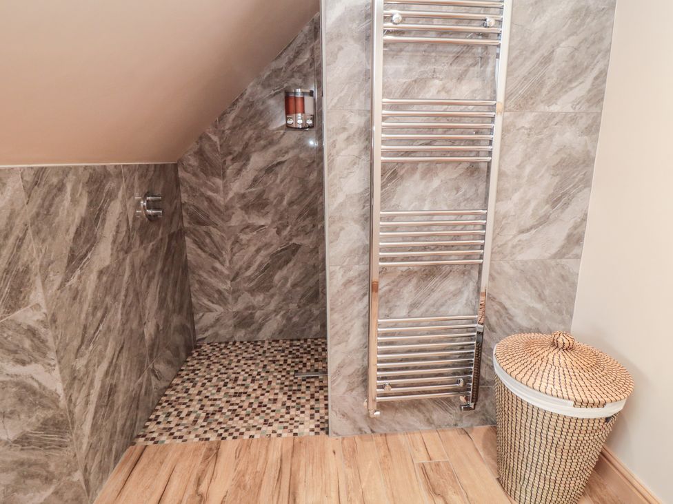 A bathroom with a shower and heated towel rail at Bay View