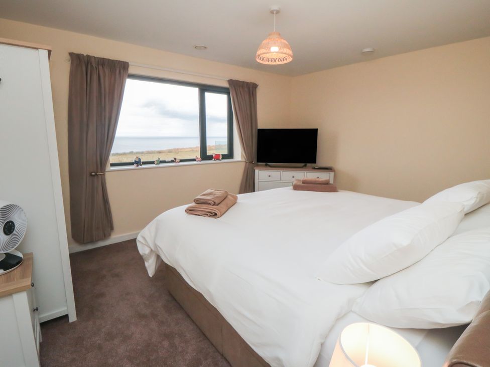 A bedroom with a bed and TV at Bay View
