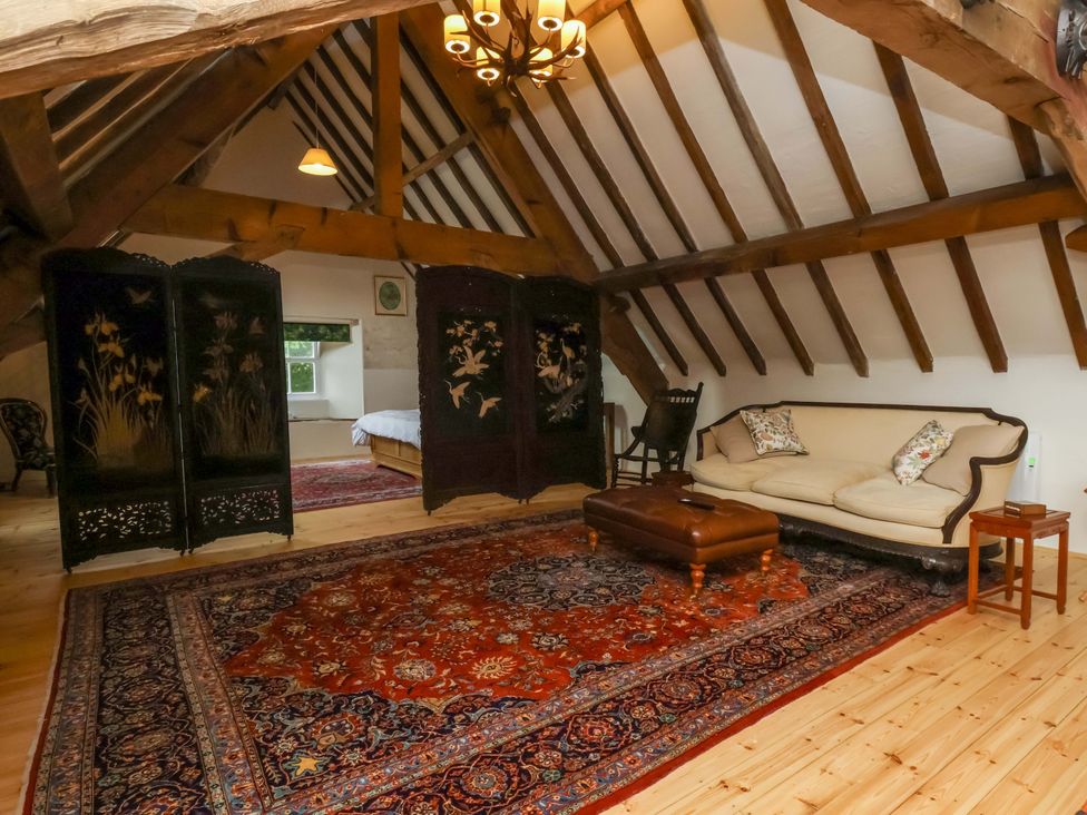 A living room with a sofa and a coffee table at The Gardener's Cottage, Low Hall in Scarborough
