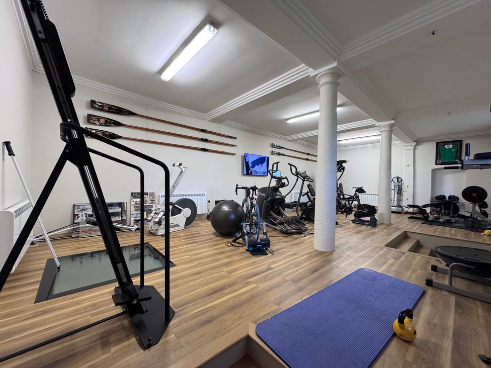 A home gym with various gym equipment at The Gardener's Cottage, Low Hall in Brompton-By-Sawdon
