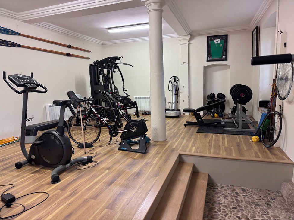 A gym with various exercise equipment at The Gardener's Cottage, Low Hall Brompton-By-Sawdon