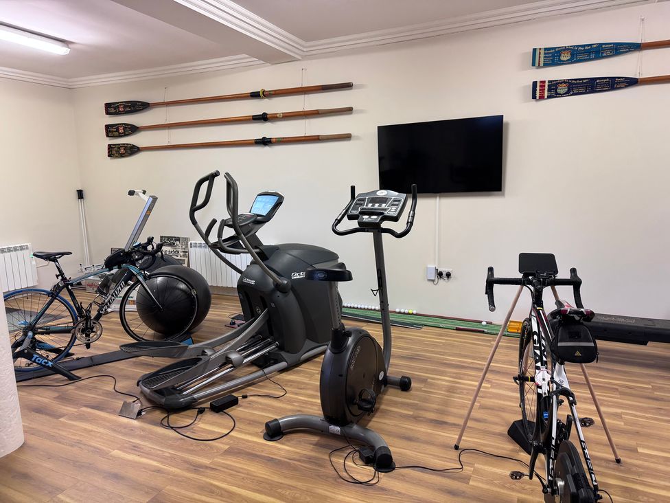 A gym with cardio equipment and rowing oars at The Gardener's Cottage, Low Hall in Brompton-By-Sawdon