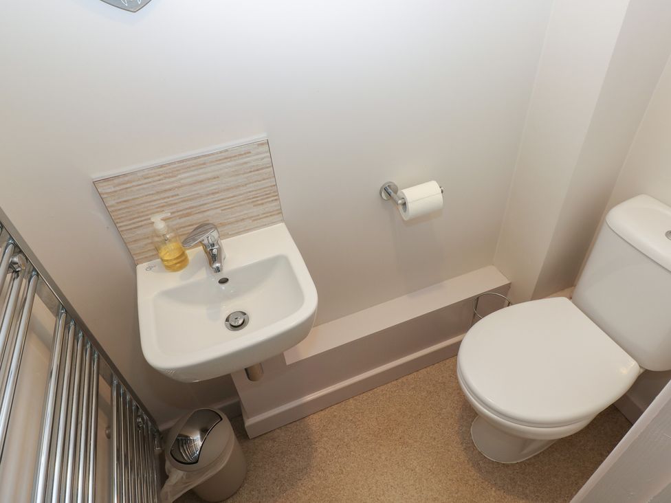 A bathroom with a sink and toilet at The Gallops in Barry