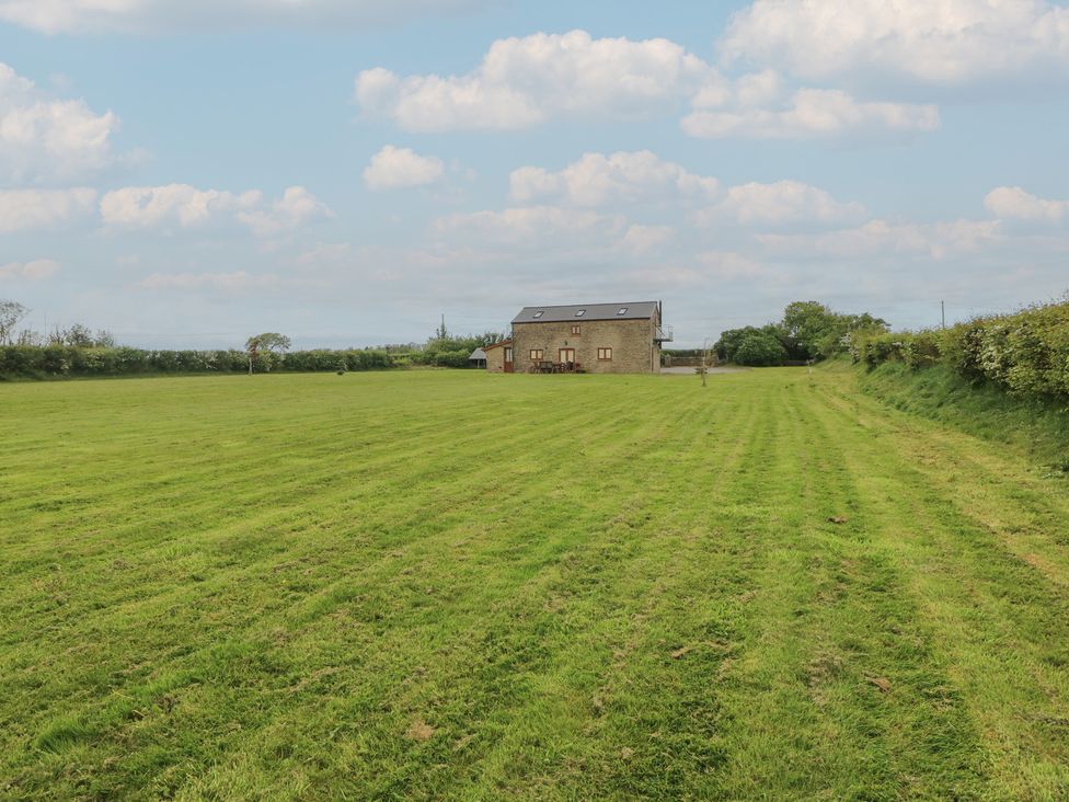 A house surrounded by a field at The Gallops in Barry