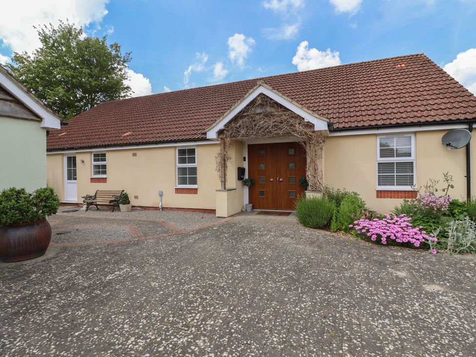 A house exterior with a front door and garden at Villina in Somerton
