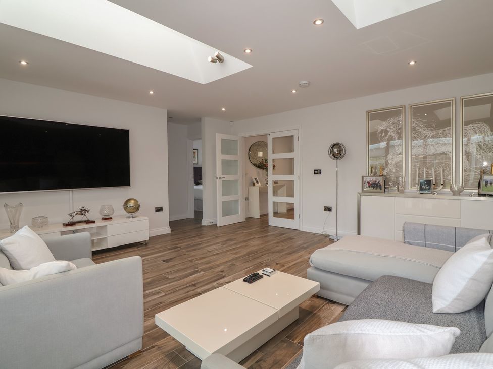 A living room with a sofa and coffee table at Villina in Somerton