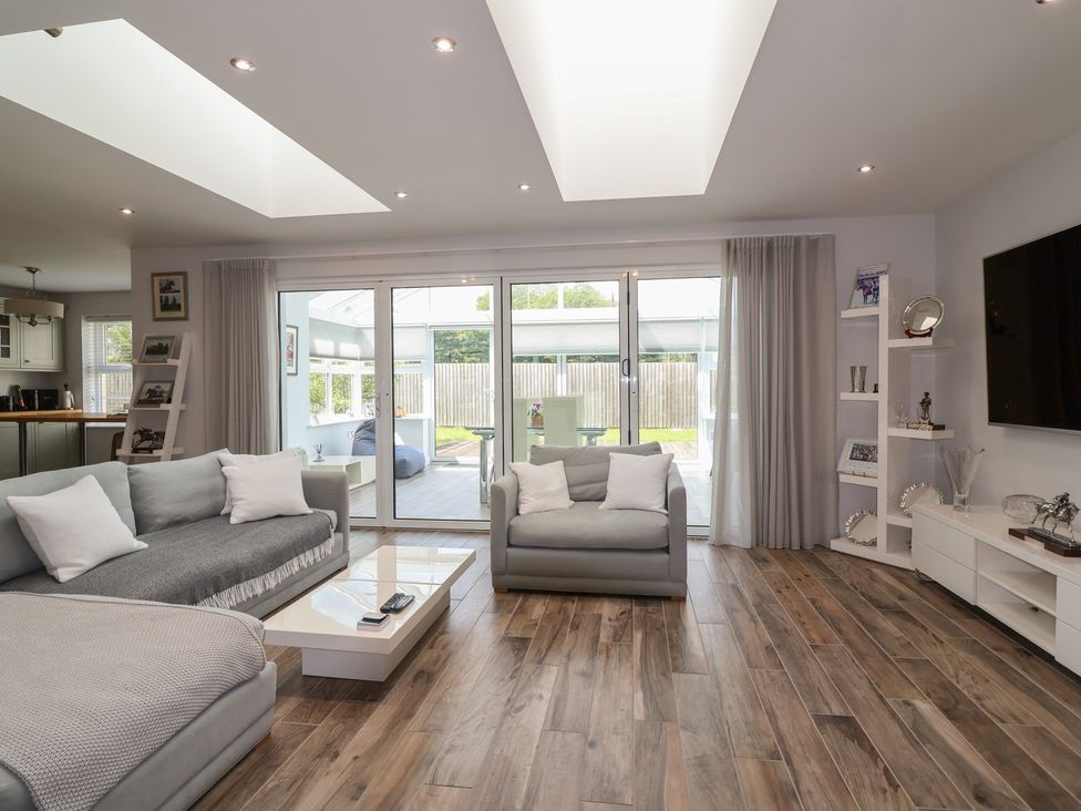 A living room with a sofa and coffee table at Villina in Somerton
