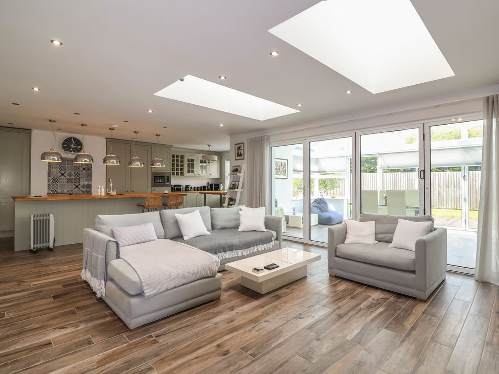A living room with a sofa and coffee table at Villina in Somerton
