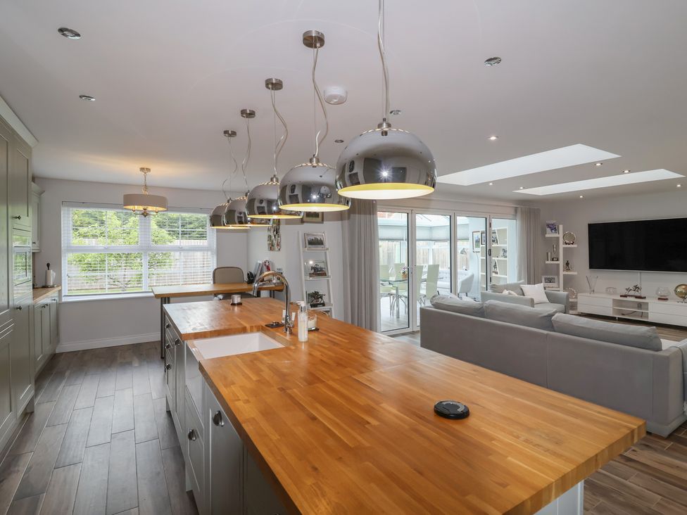 A kitchen with an island and seating at Villina in Somerton