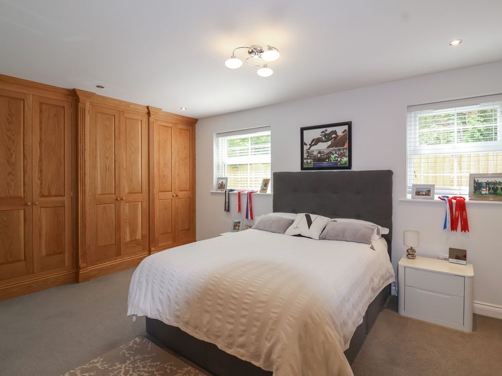 A bedroom with a bed and wardrobe at Villina in Somerton