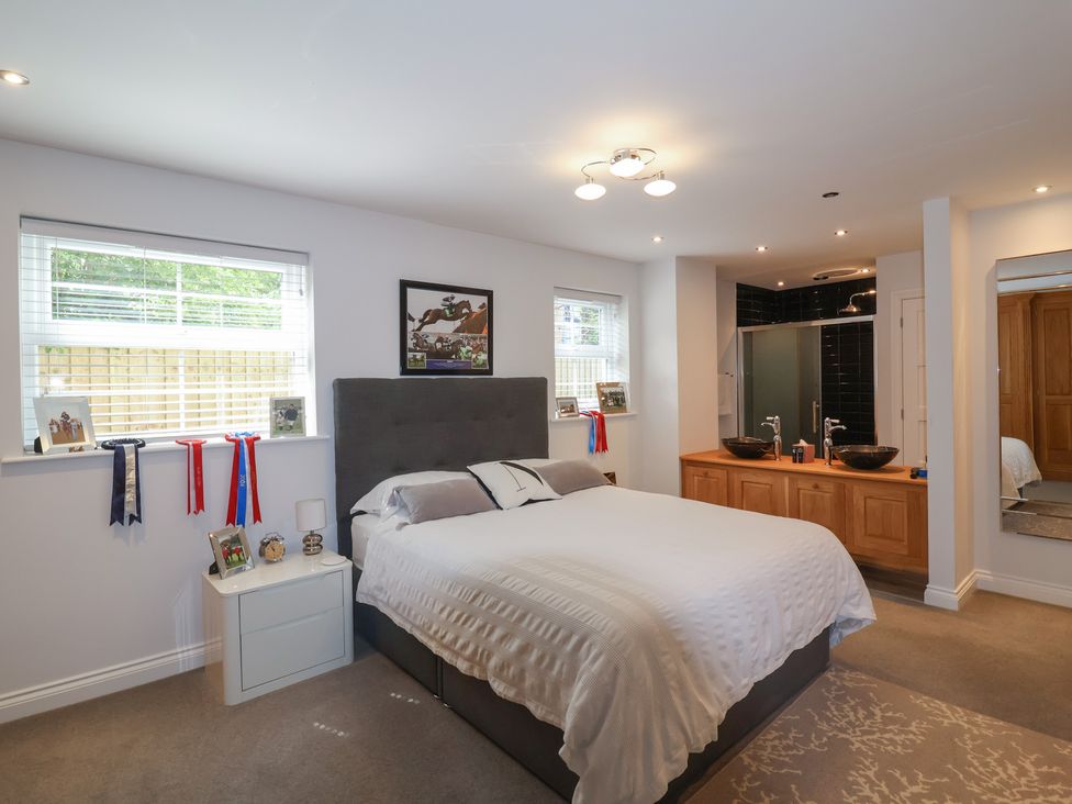 A bedroom with a bed and attached bathroom at Villina Somerton