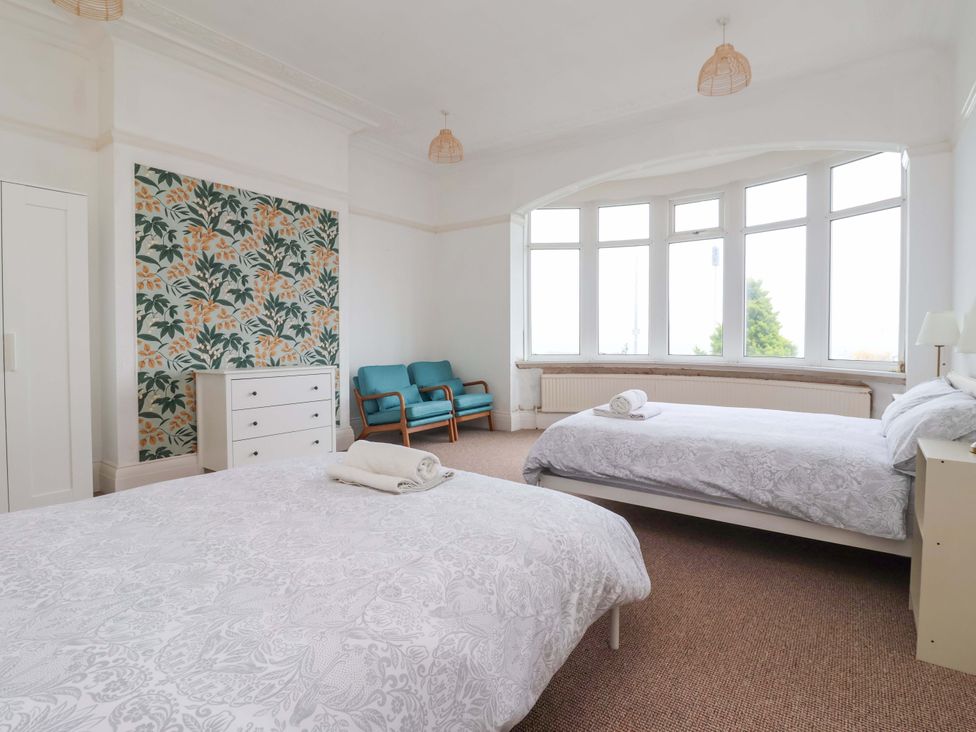 A bedroom with two beds and a dresser at 72 South Marine Drive in Bridlington