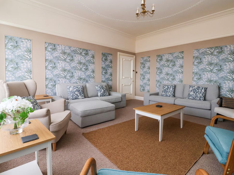 A living room with sofas and a coffee table at Sunrise Lodge in Bridlington
