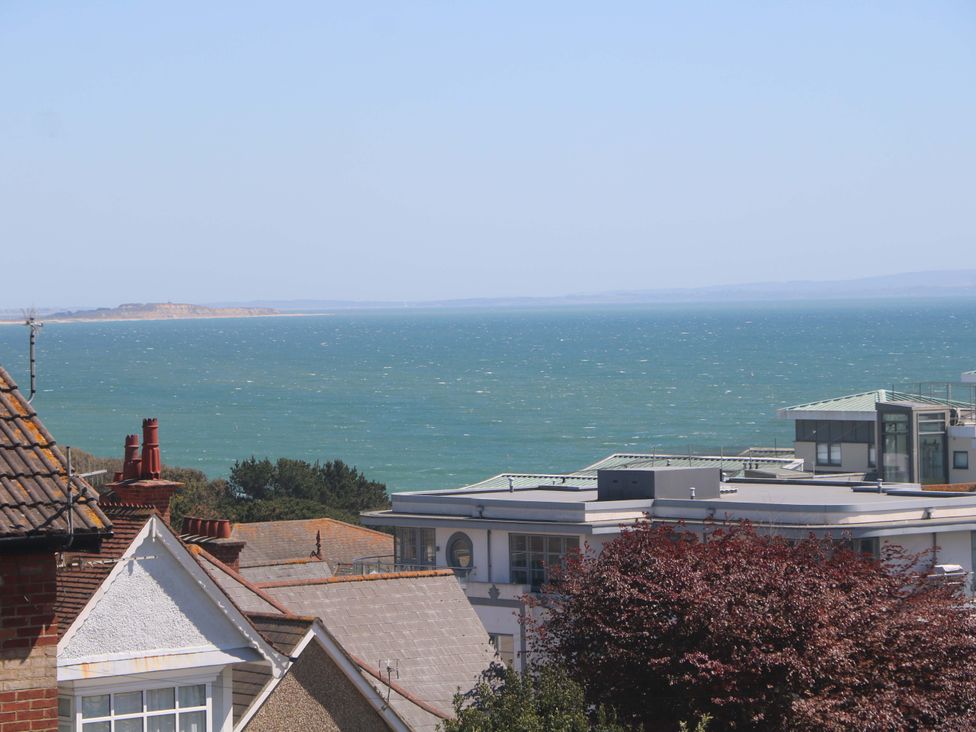 A scenic view of buildings and ocean at Shoreline Retreat in Bournemouth