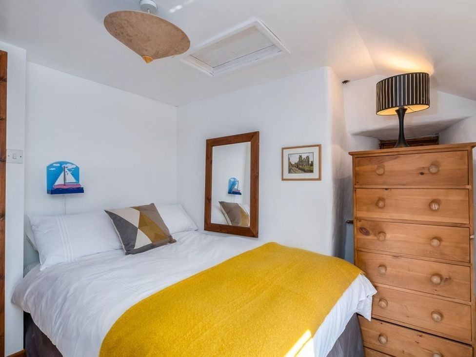 A bedroom with a bed and dresser at Trehaverock Cottage St. Endellion near Port Isaac