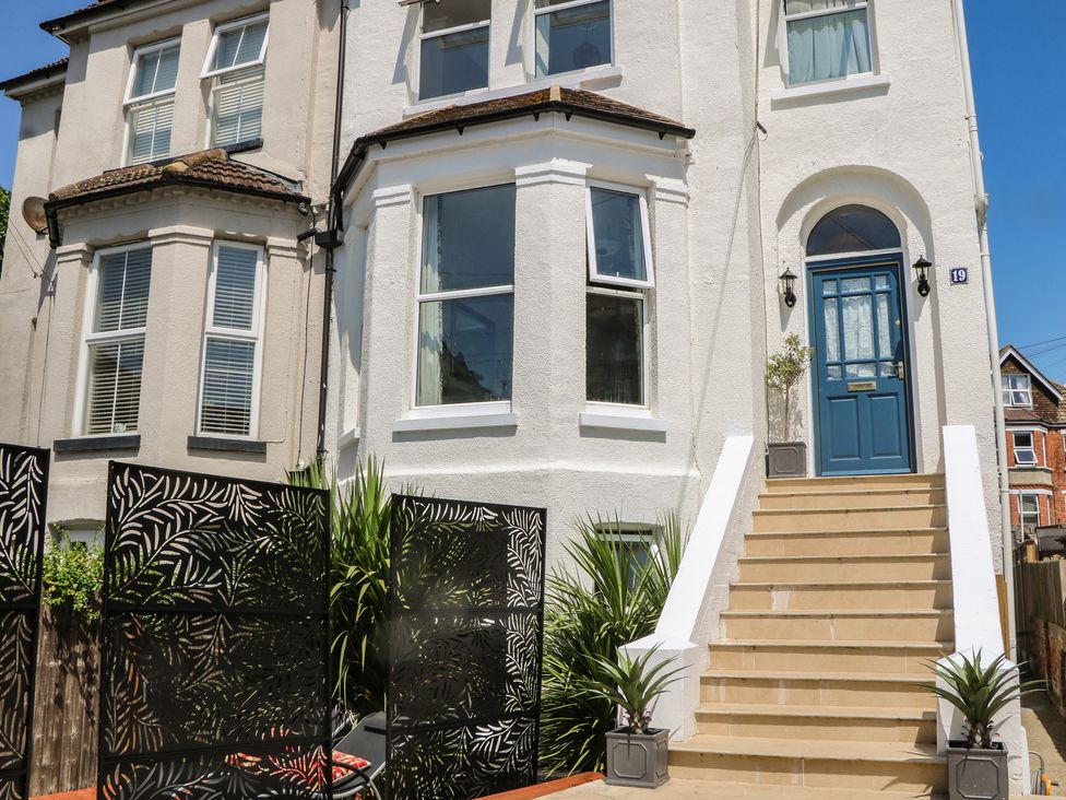 An outdoor view of a house with steps and plants at East Cliff Gardens in Folkestone