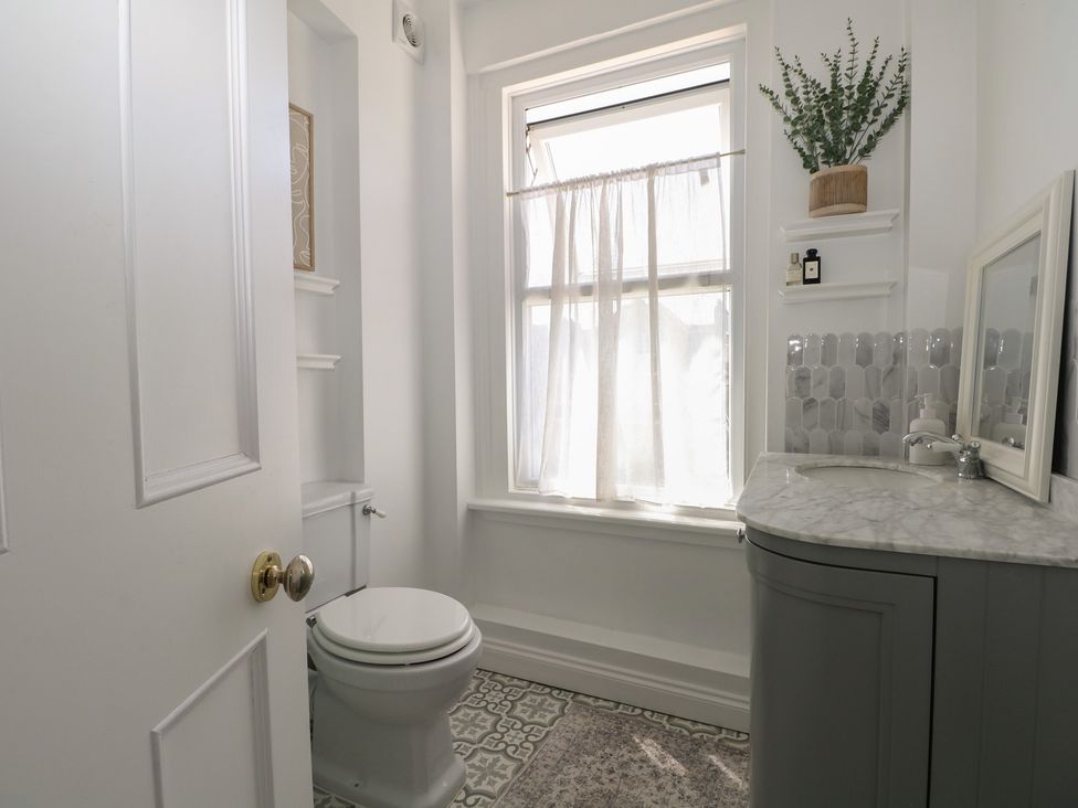 A bathroom with a toilet and sink at East Cliff Gardens in Folkestone