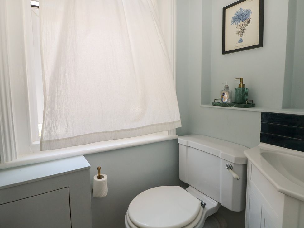 A bathroom with a toilet and sink at East Cliff Gardens in Folkestone
