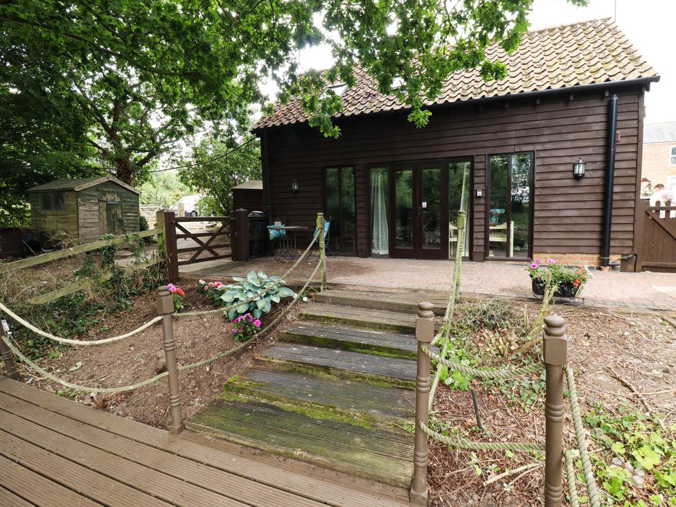 An outdoor area with steps leading to a house at Willow Tree Barn in Spalding