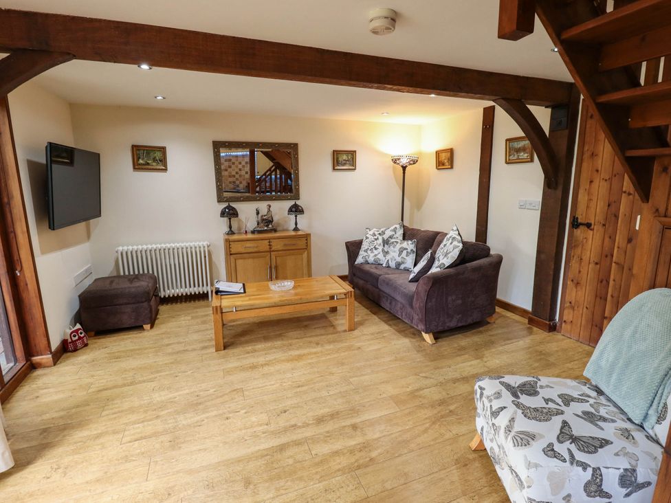A living room with sofa and coffee table at Willow Tree Barn in Spalding
