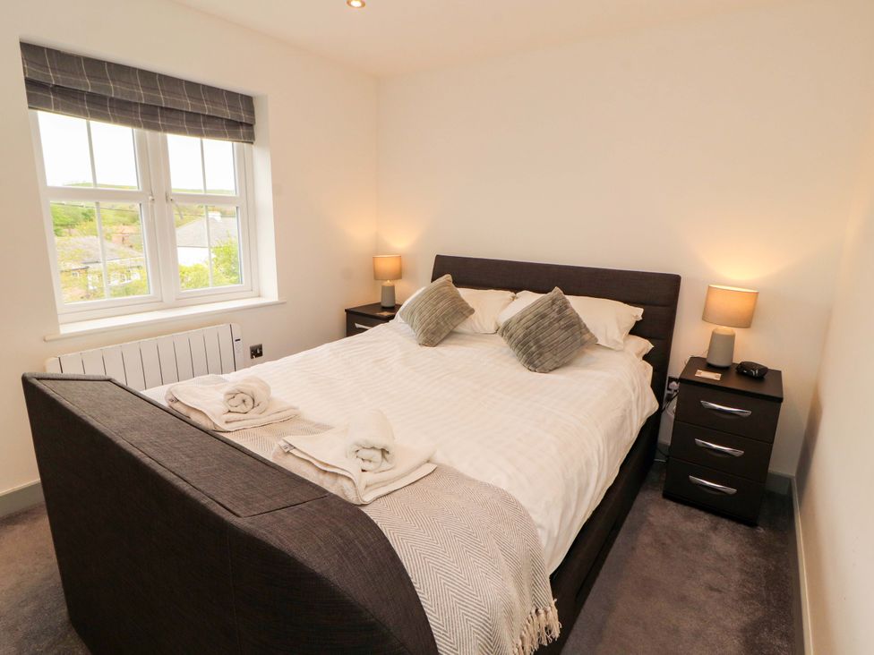 A bedroom with a bed and bedside tables at 11 The Forge in Brampton