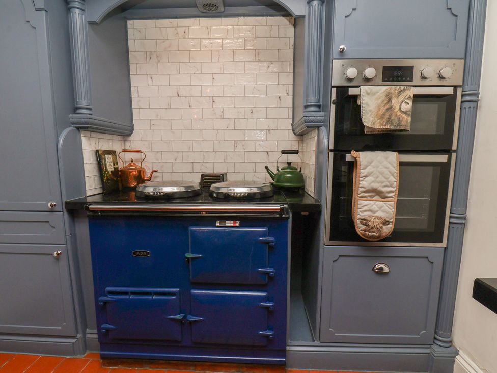 A kitchen with a blue cooker and oven at Reighton House in Reighton near Filey