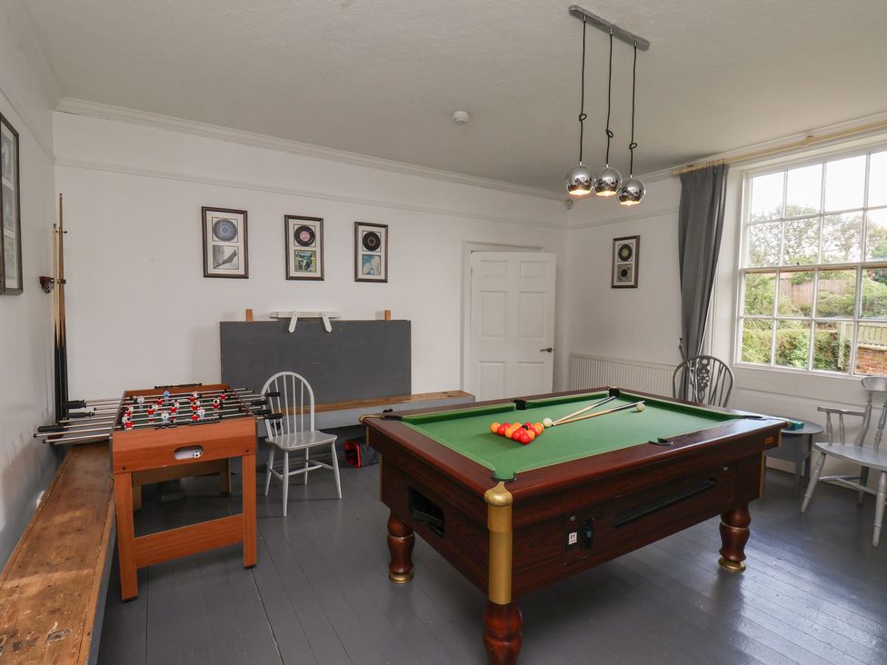 A games room with a pool table and foosball table at Reighton House Reighton near Filey