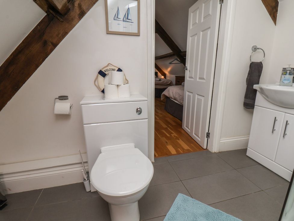 A bathroom with a toilet and sink at Reighton House in Reighton near Filey