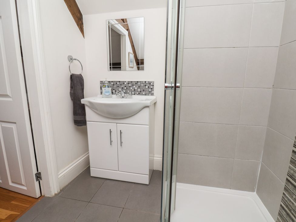 A bathroom with a sink and shower at Reighton House in Reighton near Filey