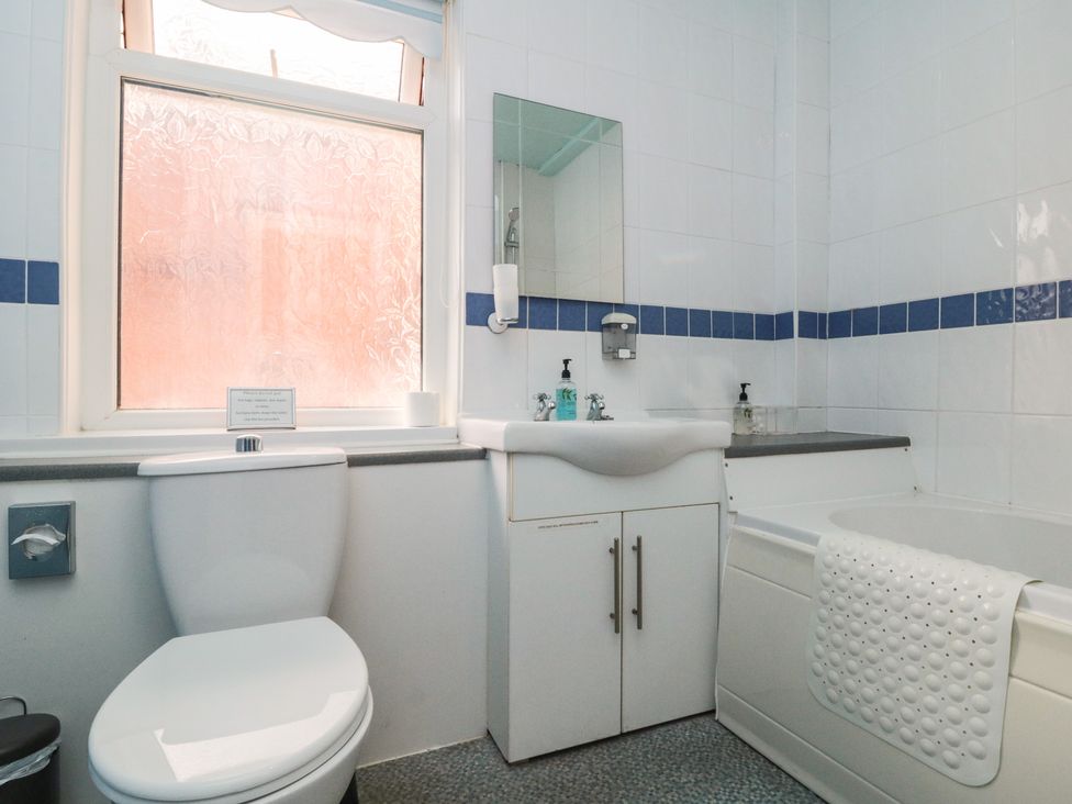 A bathroom with a toilet and sink at Meltham Guest House in Scarborough