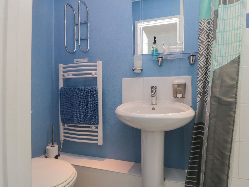 A bathroom with a toilet and sink at Meltham Guest House in Scarborough
