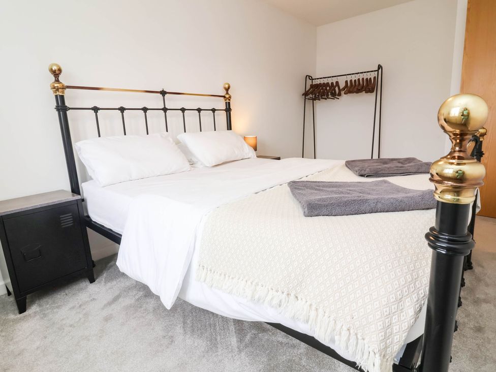 A bedroom with a bed and nightstand at 24 Higher Gorse Road Roughton