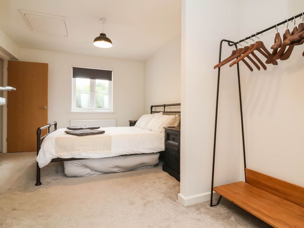 A bedroom with a bed and bedside table at 24 Higher Gorse Road Roughton