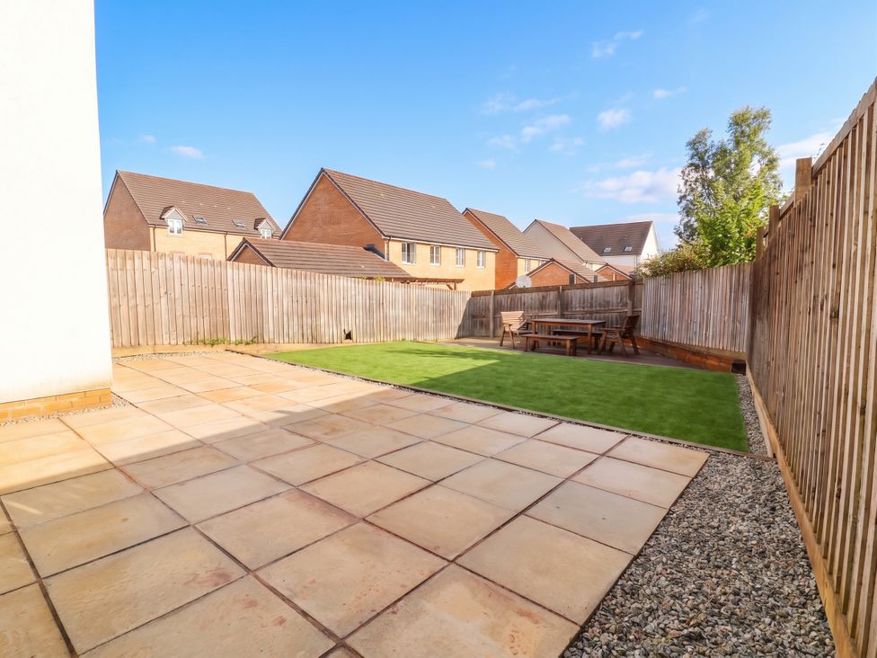 A garden with patio and grass at 24 Higher Gorse Road, Roughton