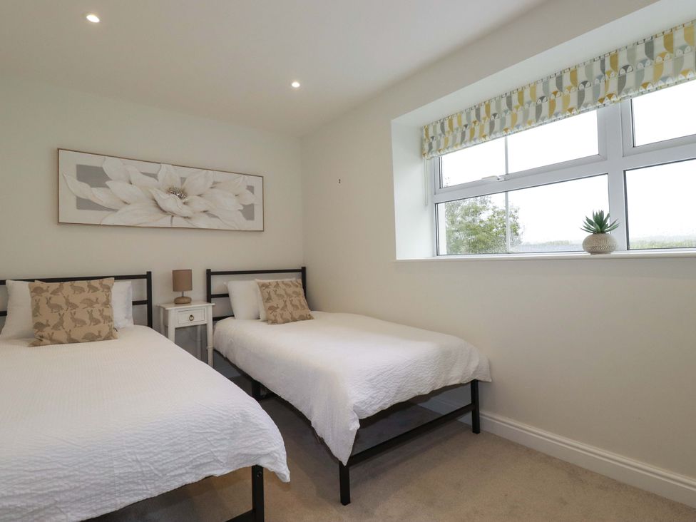 A bedroom with two beds and a window at Seveock in Threemilestone