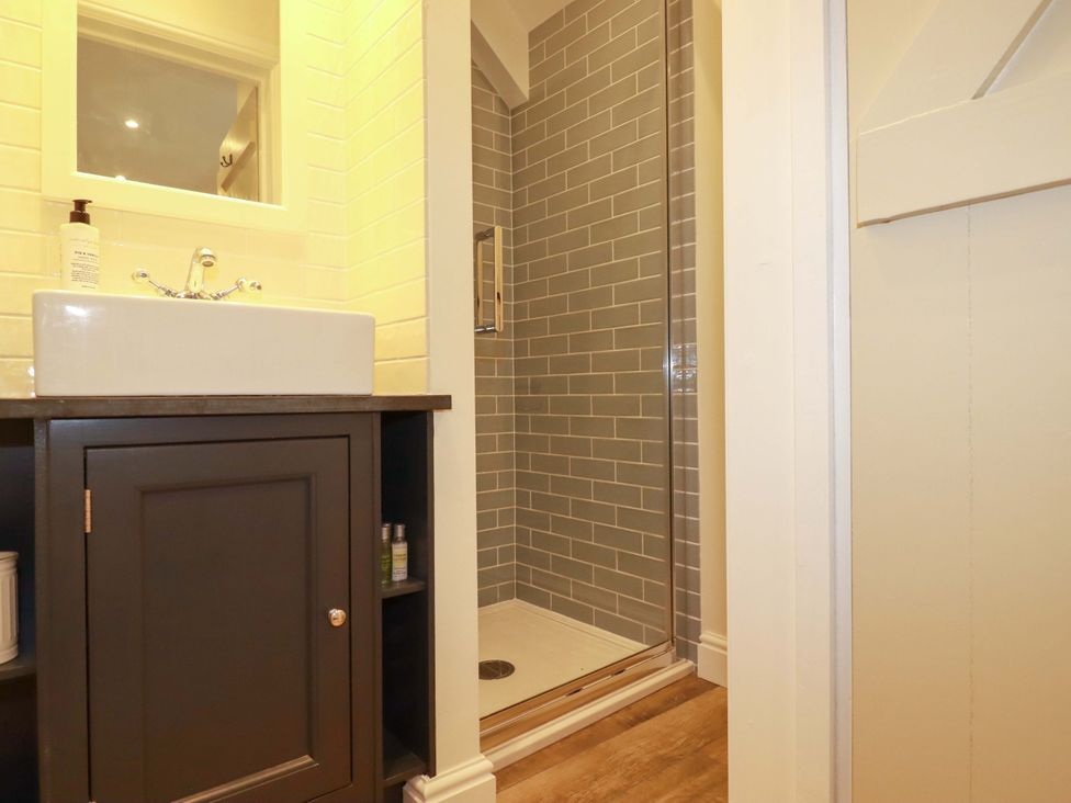 A bathroom featuring a sink and shower at Seveock in Threemilestone